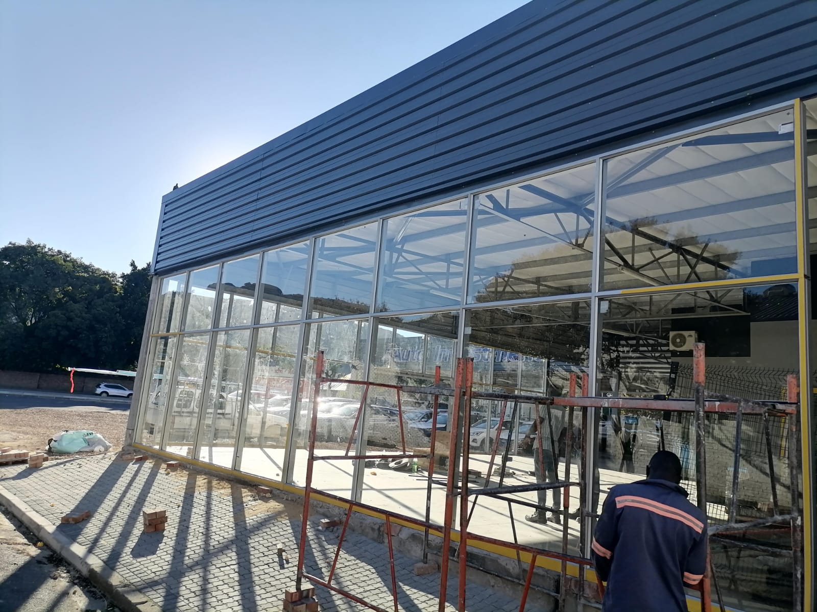 Newly installed aluminium and glass shopfront at Auto Investments car dealership in Paarl.