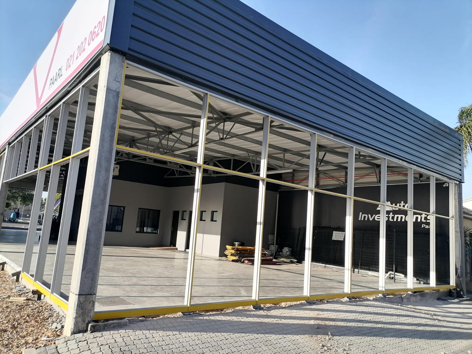 Close-up view of aluminium shopfront framing and glass panels at Auto Investments Paarl.