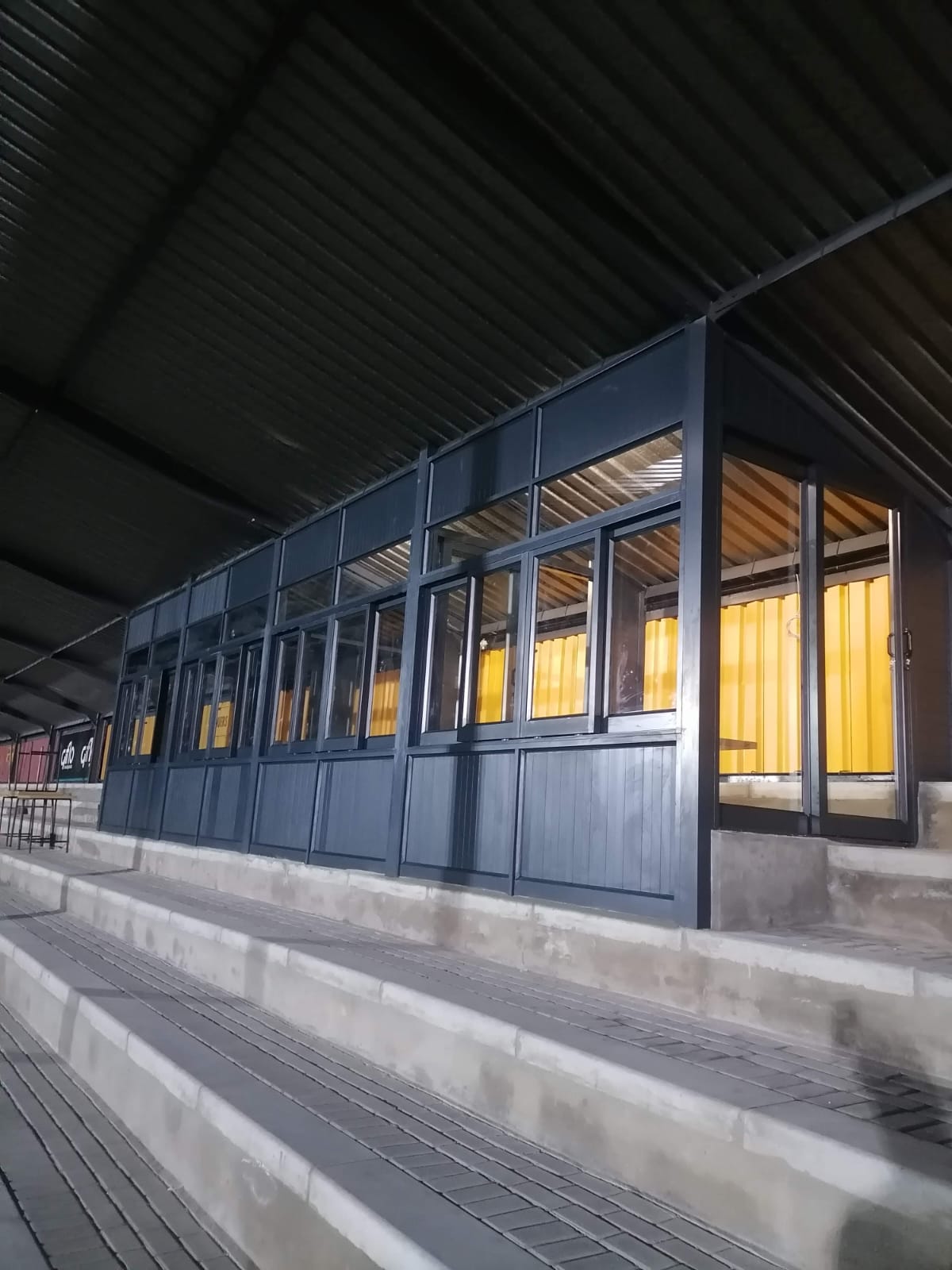 Large aluminium sliding windows installed on the front of Paarl Gymnasium High School stadium.