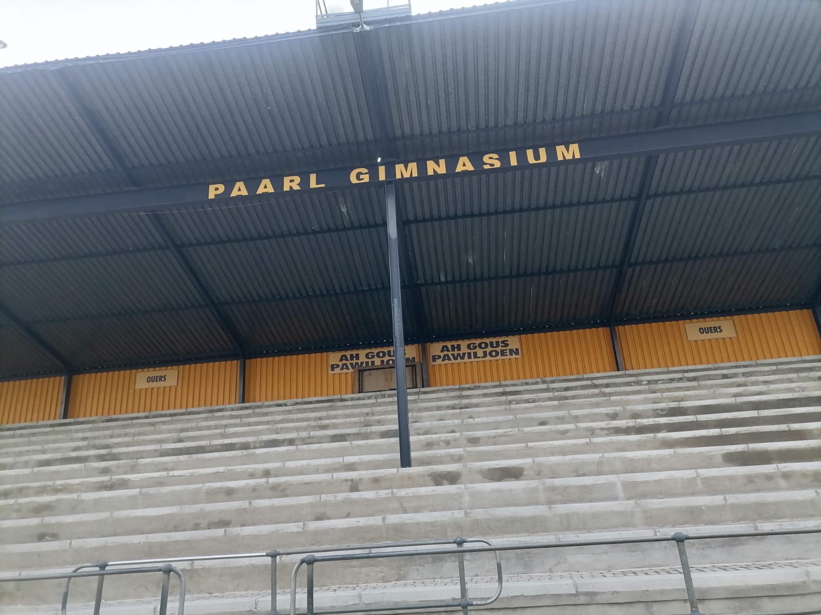 Full view of Paarl Gymnasium High School stadium exterior featuring aluminium sliding windows.