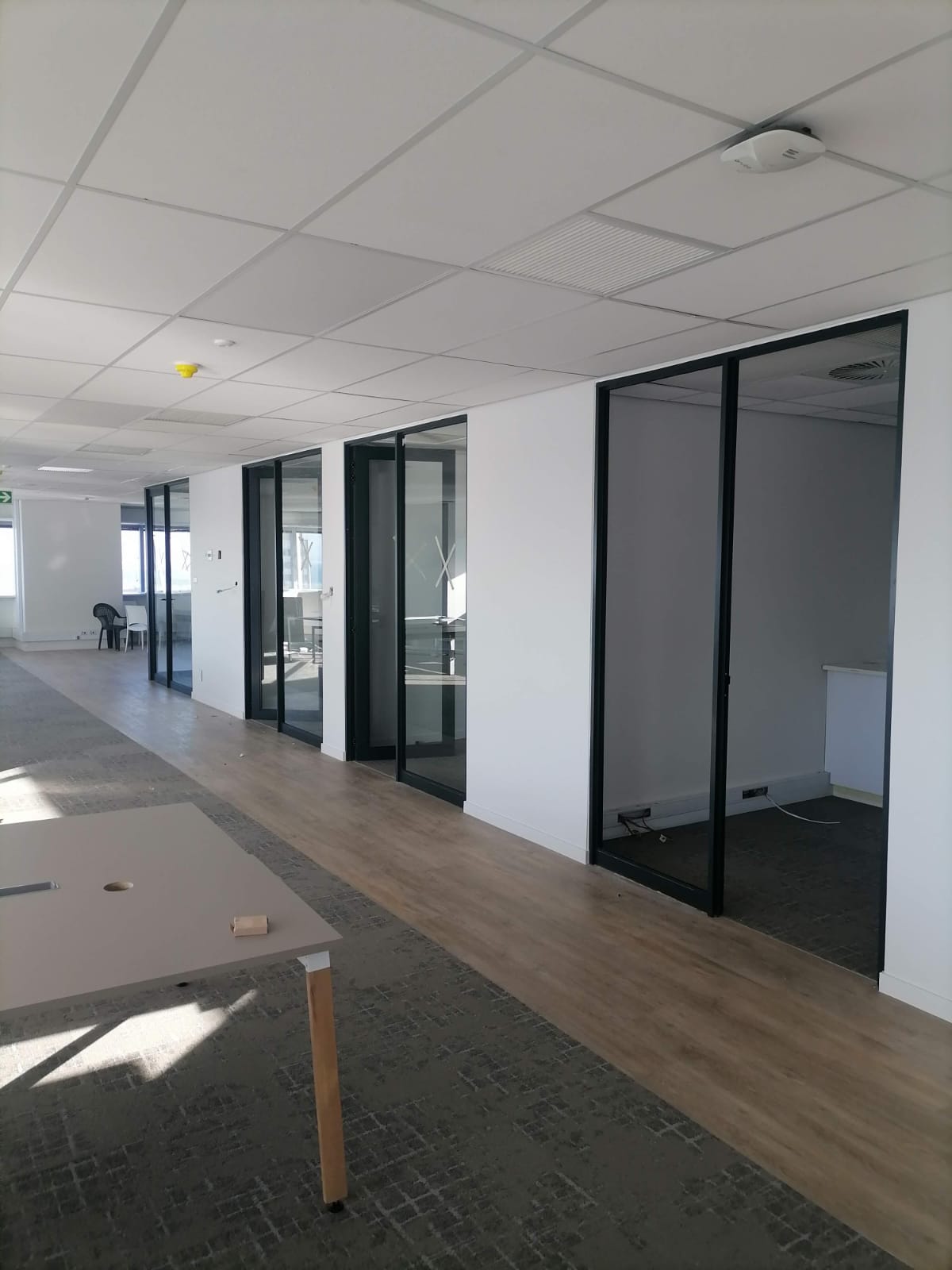 Double sliding aluminium office doors installed for Standard Bank offices in Cape Town.