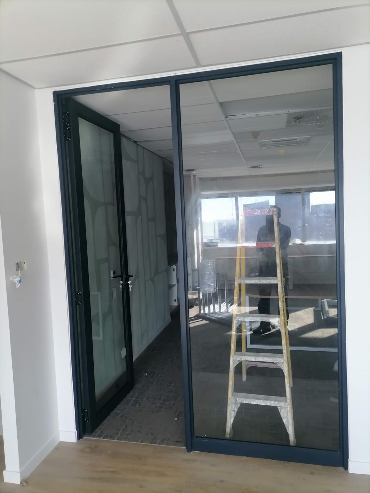 Single aluminium sliding door installed for an individual office at Standard Bank, Cape Town.