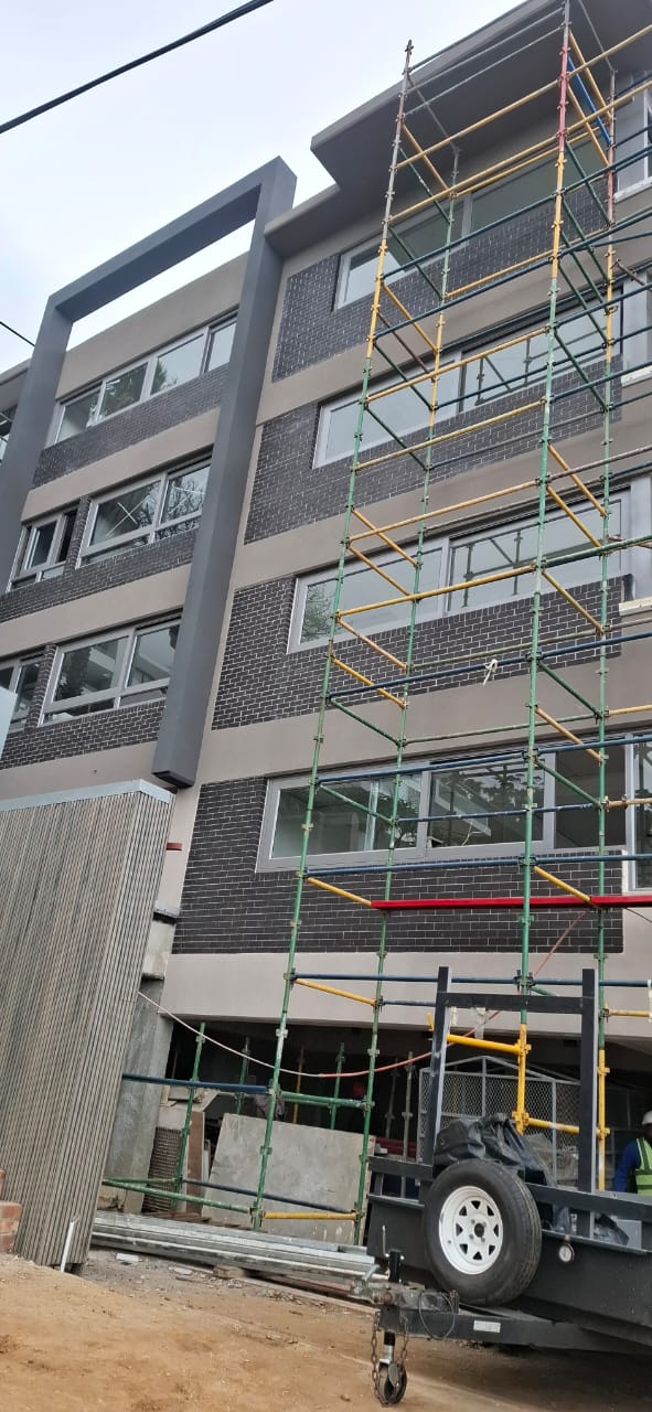 Lower-level façade glazing of the Clifford Road building in Sea Point.