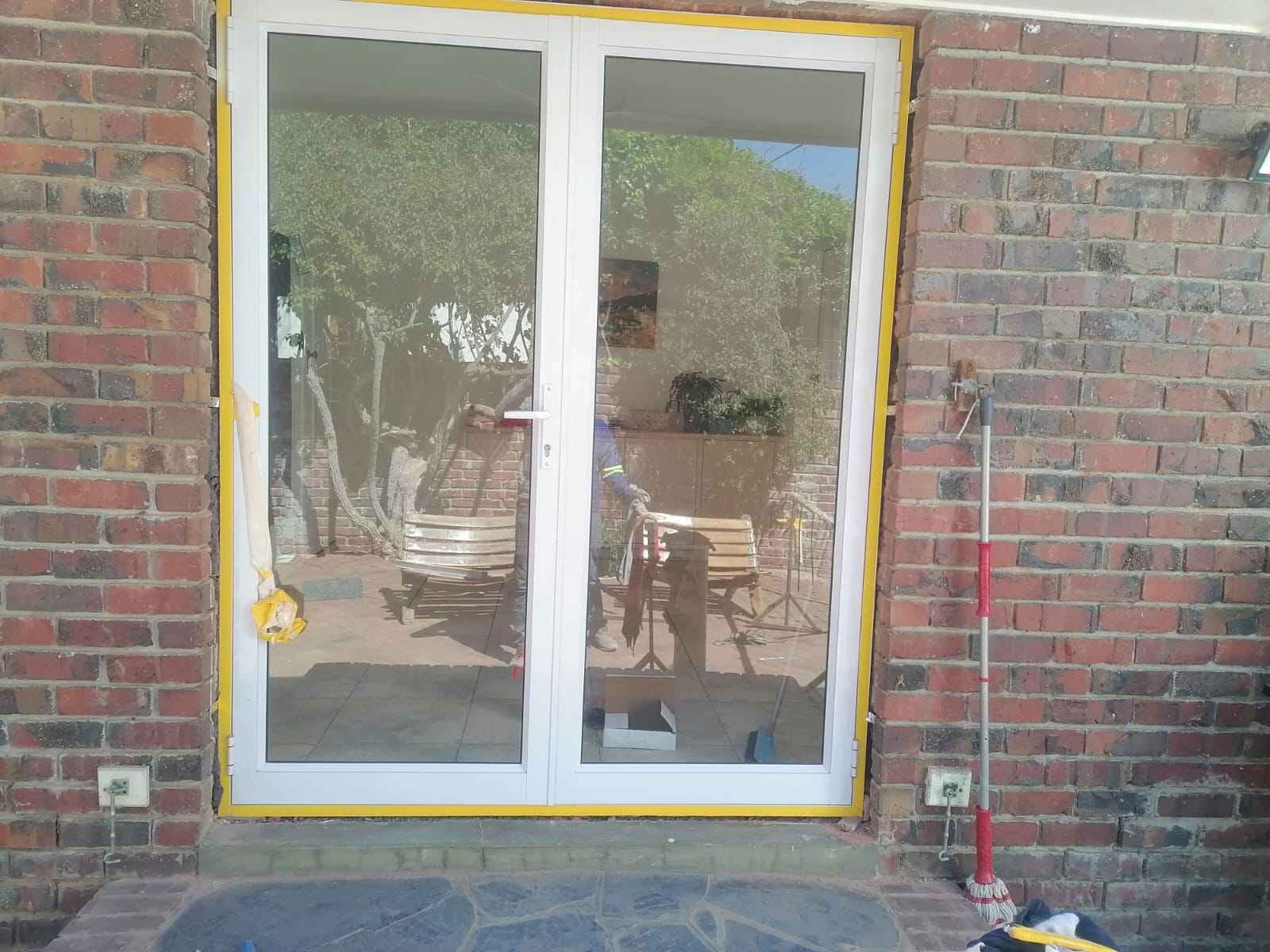 Double aluminium sliding doors installed at the rear of a Durbanville property.