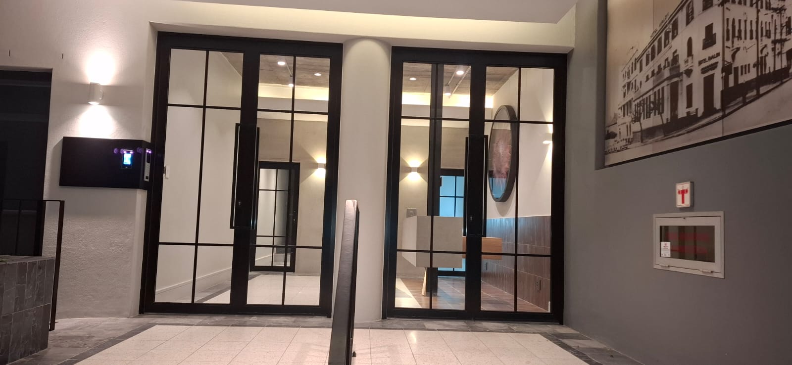 Large aluminium and glass main entrance door at the Avalon Building, Cape Town CBD.