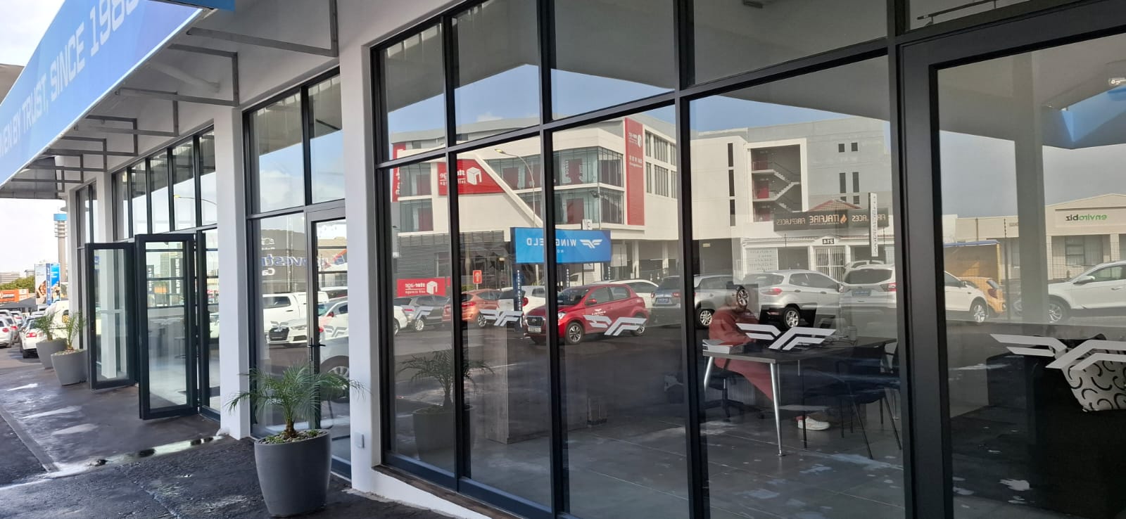 Wingfield Motors shopfront installation in Goodwood, Cape Town – aluminium and glass assembly in progress.