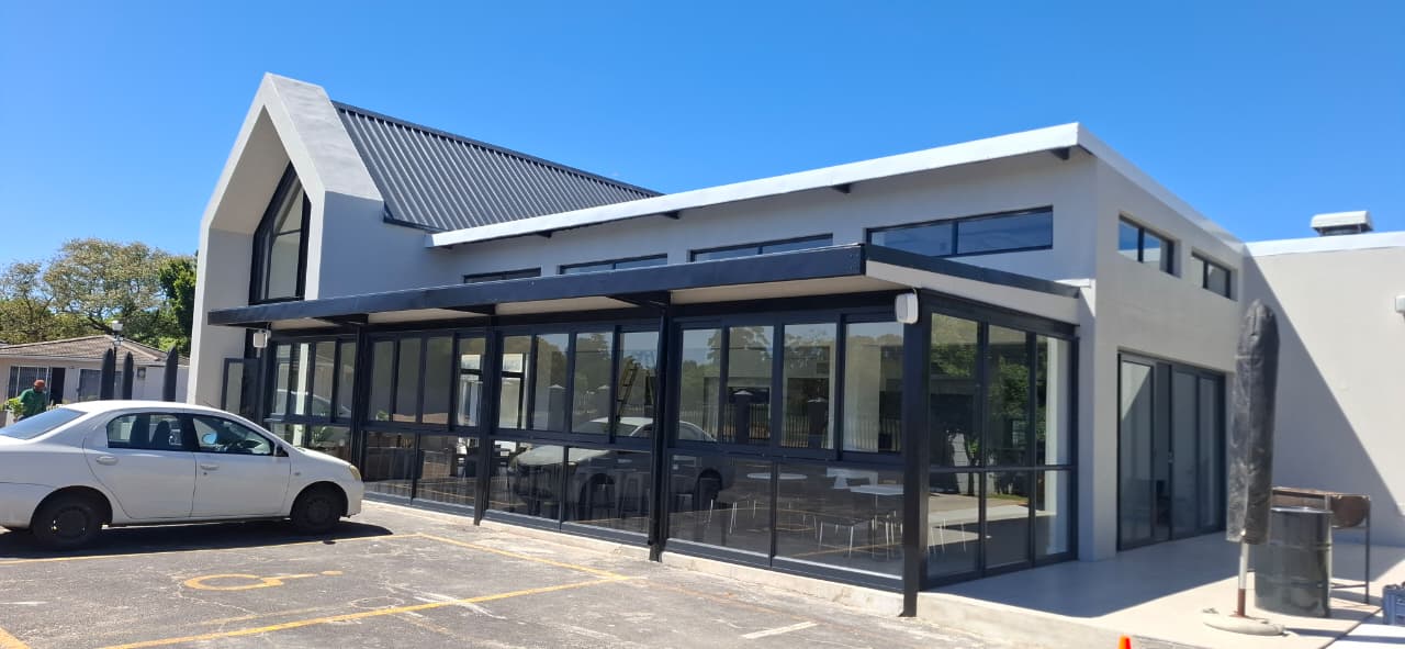 Wide view of Urban Church sliding aluminium doors and glass display wall, Durbanville.