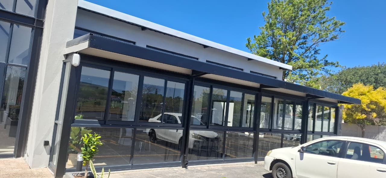 Side front aluminium sliding doors with glass entry door and handles at Uban Church, Durbanville.