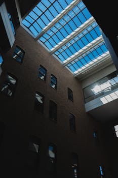 A modern skylight design illuminates an indoor atrium in Grand Rapids, emphasizing architectural elegance.